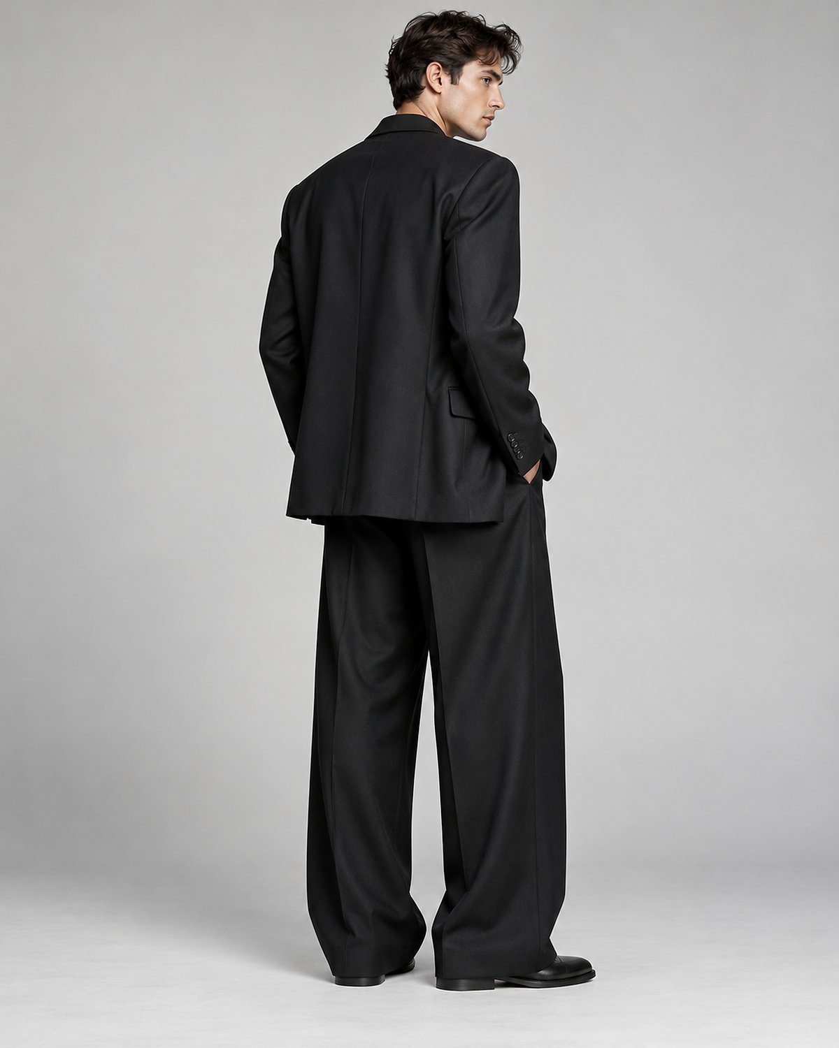 DFCOLOR::Black::back-side — Black Oversized Wide-Leg Two-Piece Suit — black serge jacket back construction and wide-leg trouser drape