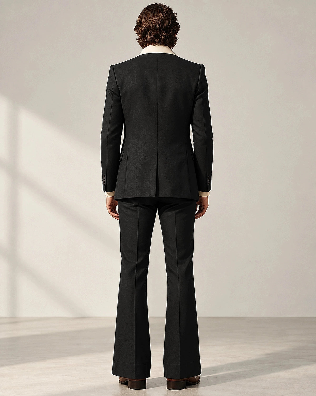 DFCOLOR::Black::Retro 70s two-piece flare suit — black rear silhouette and flared trousers